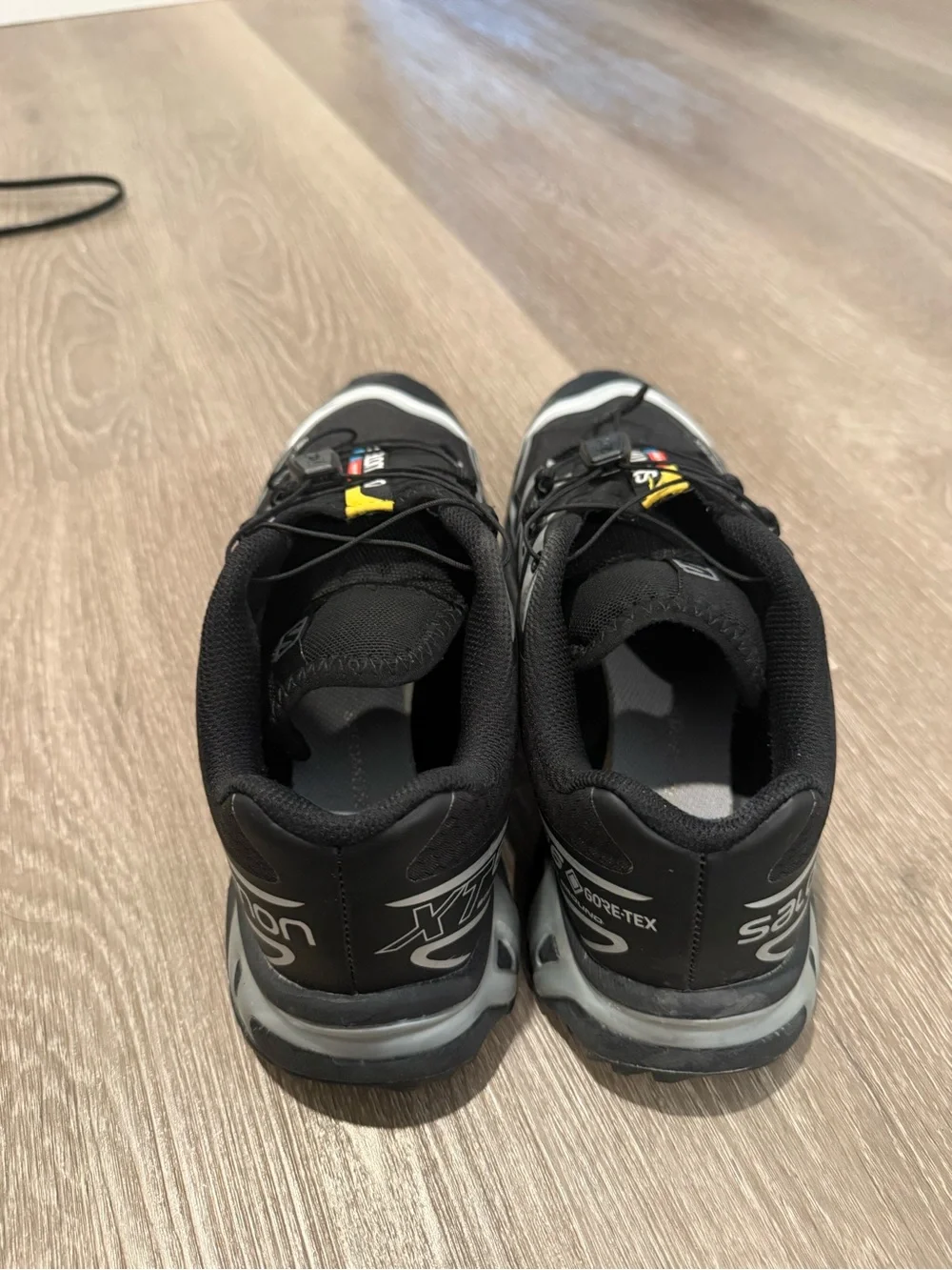 Black and Gray Trail Sneakers with Yellow Accents